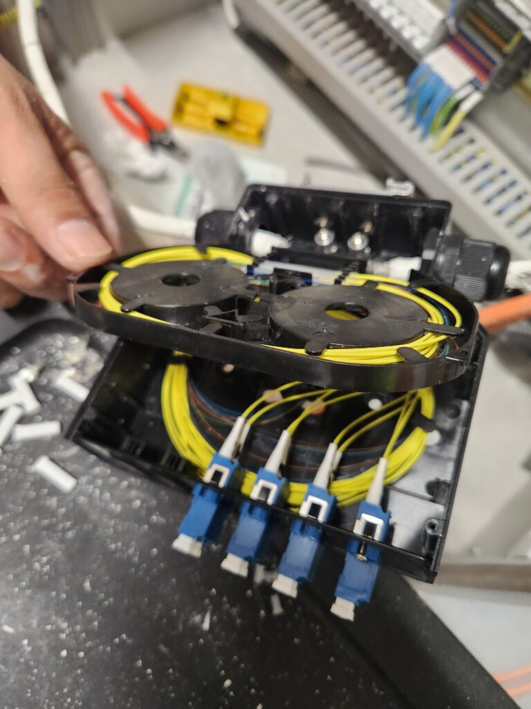 Active fiber optic network rack with connected industrial communication infrastructure